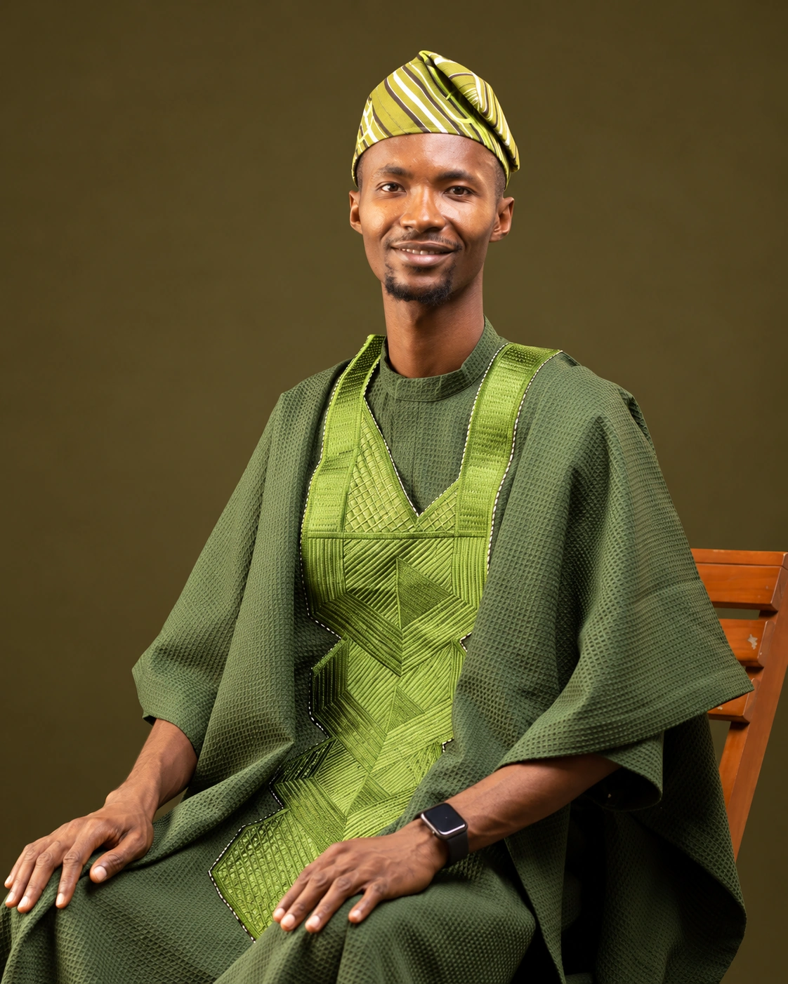 Ajíbọ́lá Ọládìípọ̀ in green traditional attire