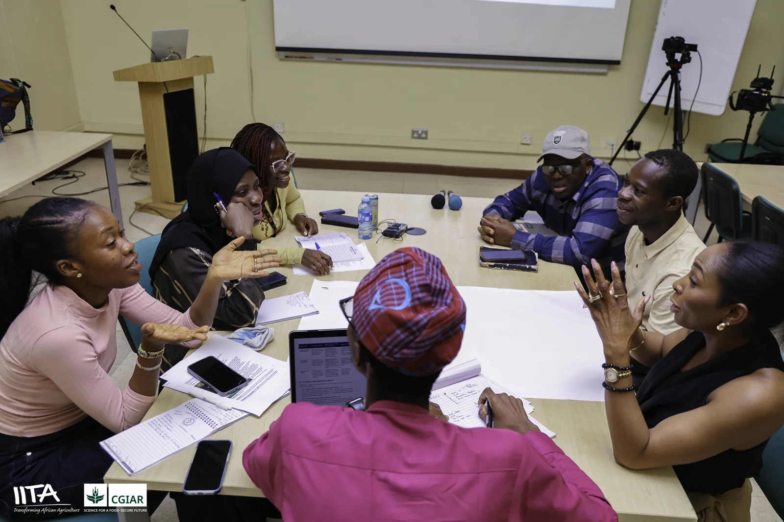 Participants discussing policy around a workshop table